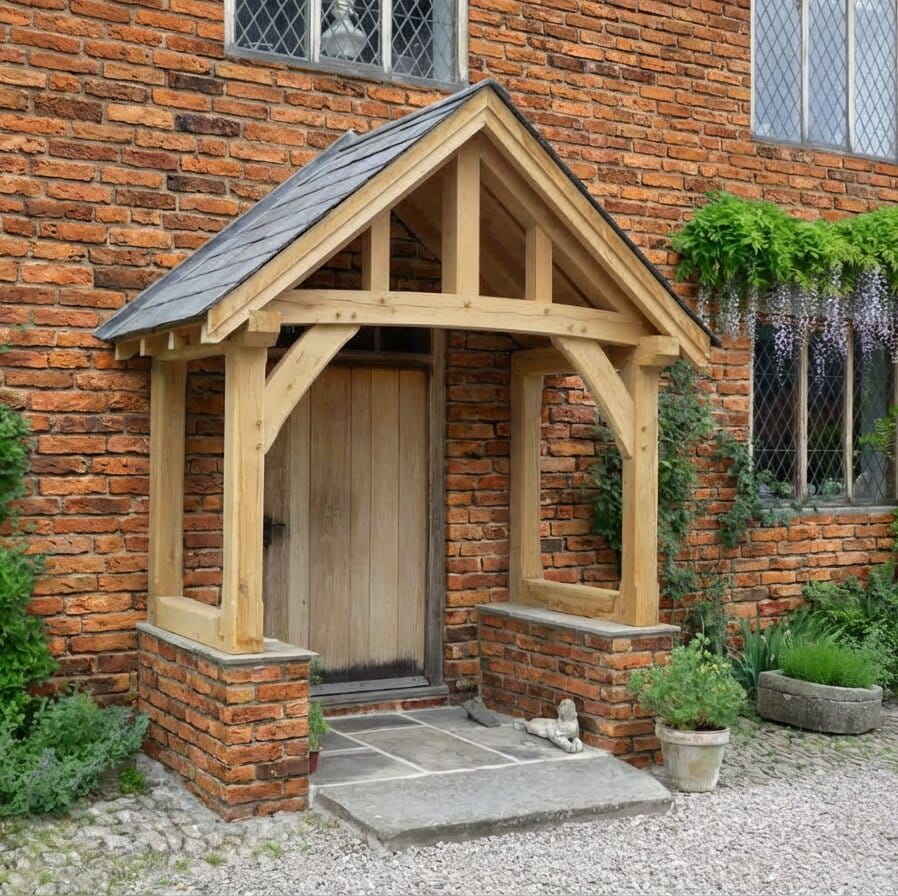 A hand-crafted oak framed front porch with a pitched tiled roof, installed on a traditional red brick house.